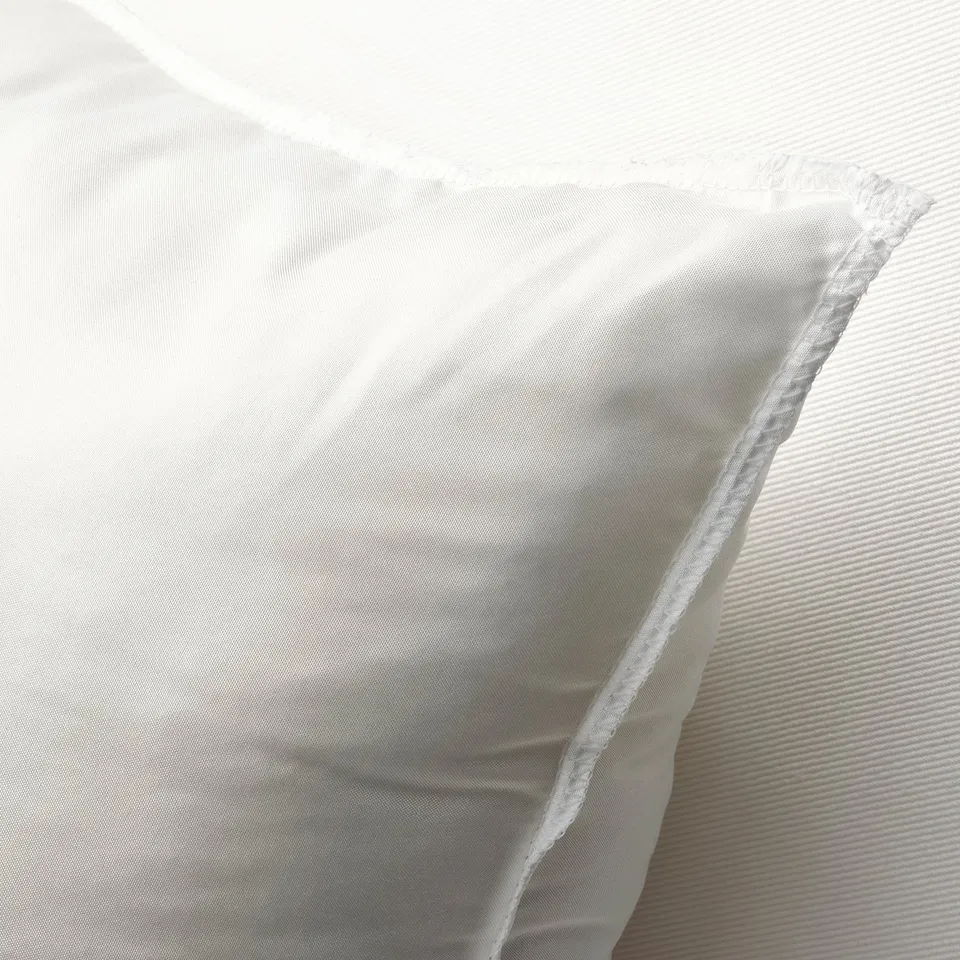 Plump cushioned pad for sofa or chair, featuring dense filling and smooth, textured fabric cover.