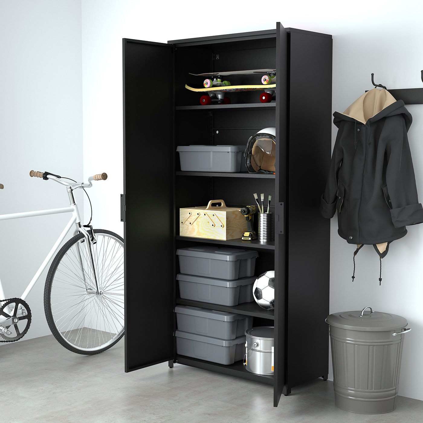 Black storage cabinet in garage holds grey bins, sports gear, and tools. Bike and jackets nearby.
