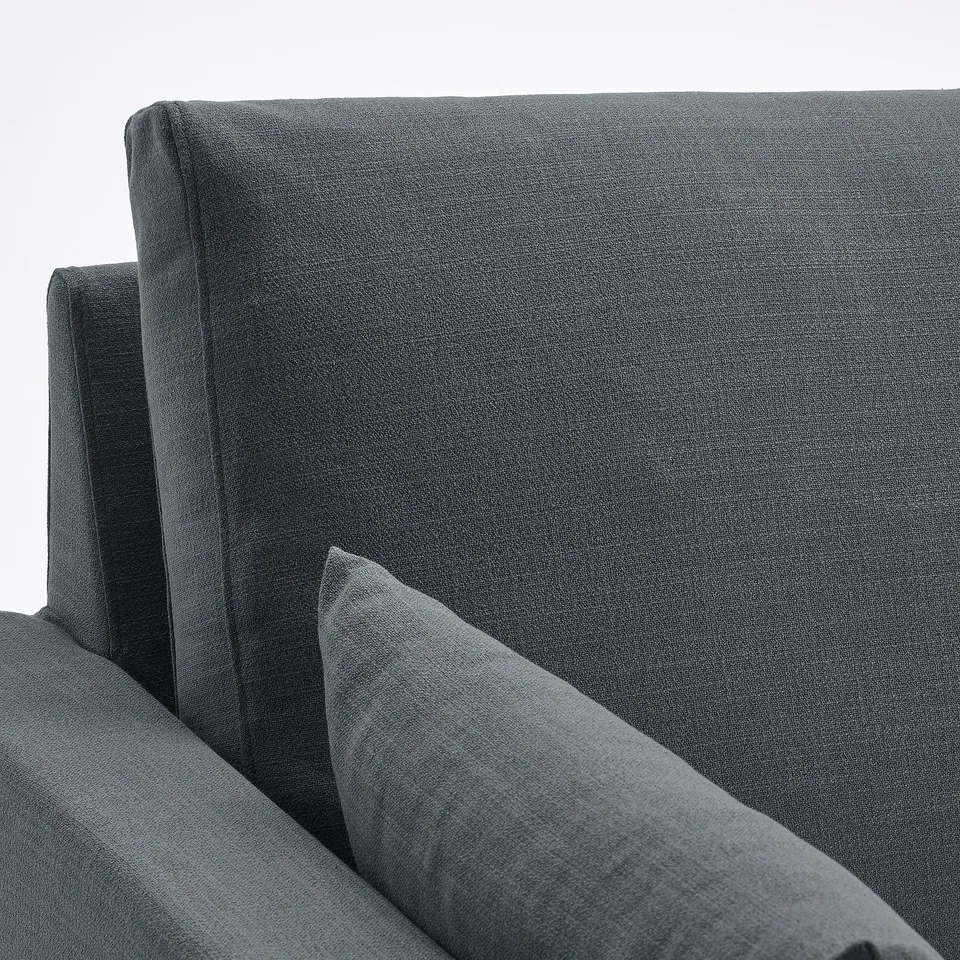 Close-up of modern dark grey sofa, showing clean lines and quality upholstery.
