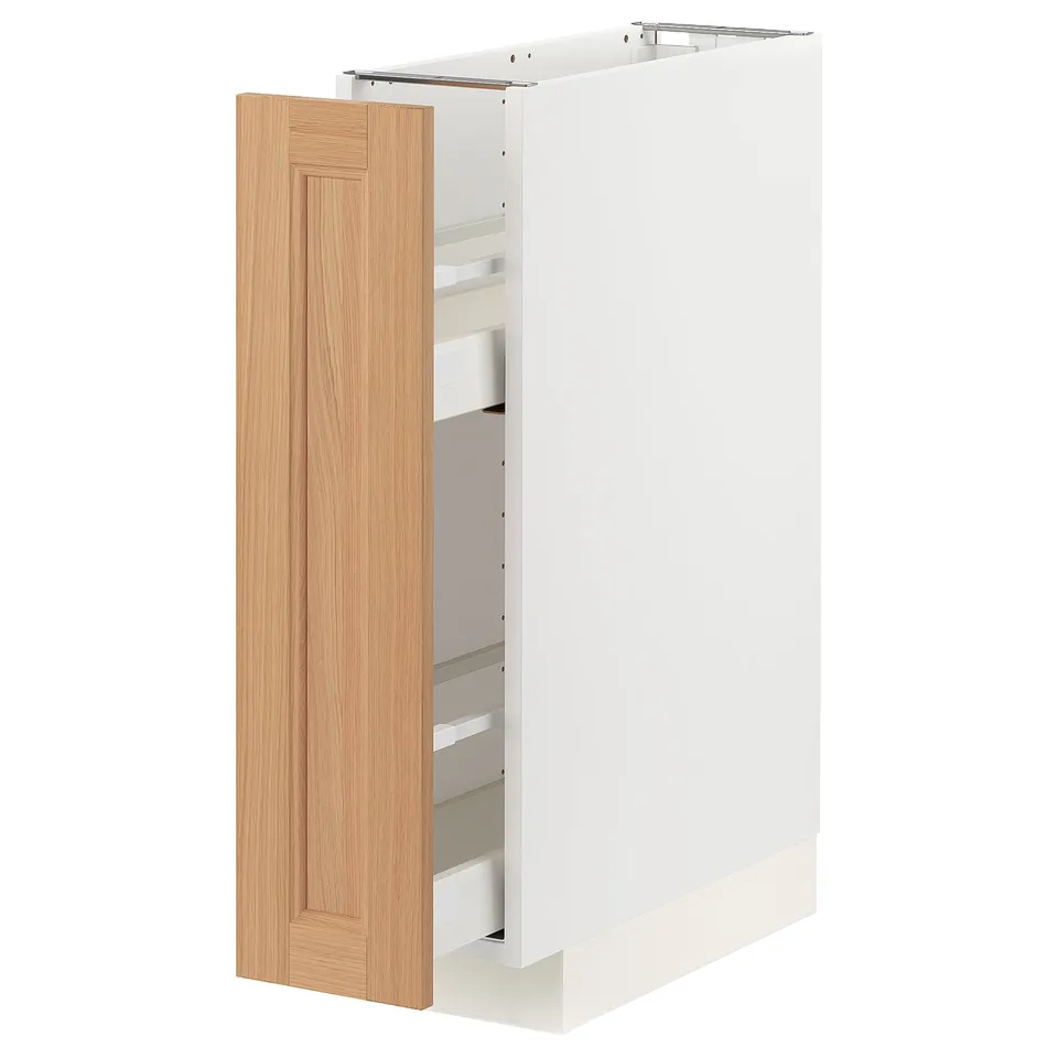 A white METOD kitchen cabinet with a light brown oak door, open to reveal shelves and pull-out drawers.
