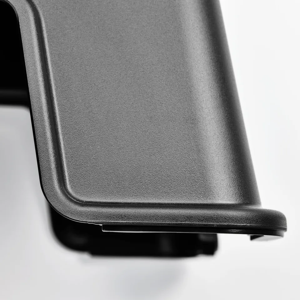 Black step stool with smooth, anti-slip surface and sturdy base.