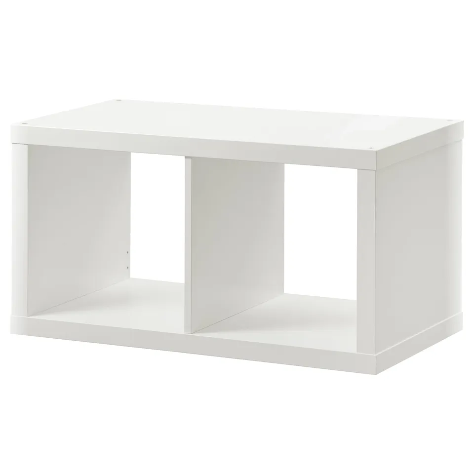 A white ikea KALLAX shelf, rectangular and open, made from particleboard and fibreboard.
