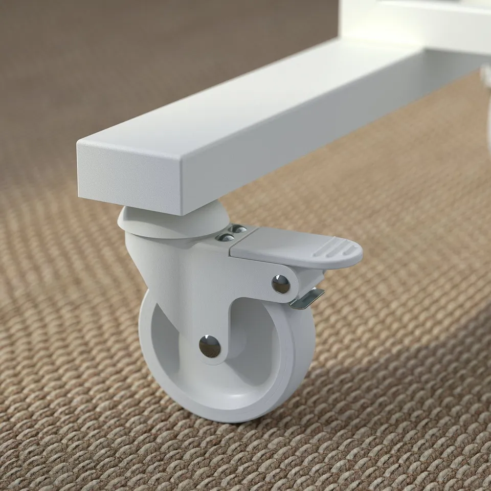 Close-up of a sturdy, white castor with lock for mobile shelving unit.