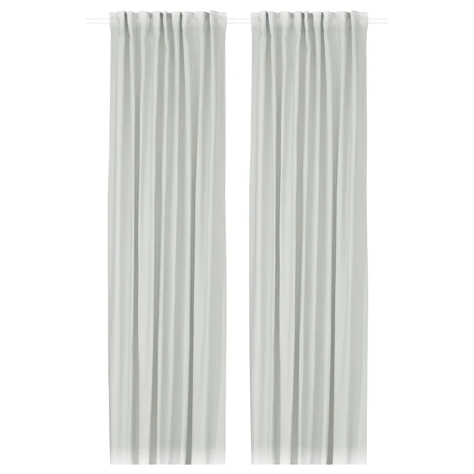 Image shows white GINSTMOTT curtains, sleek and straight, made from recycled polyester.