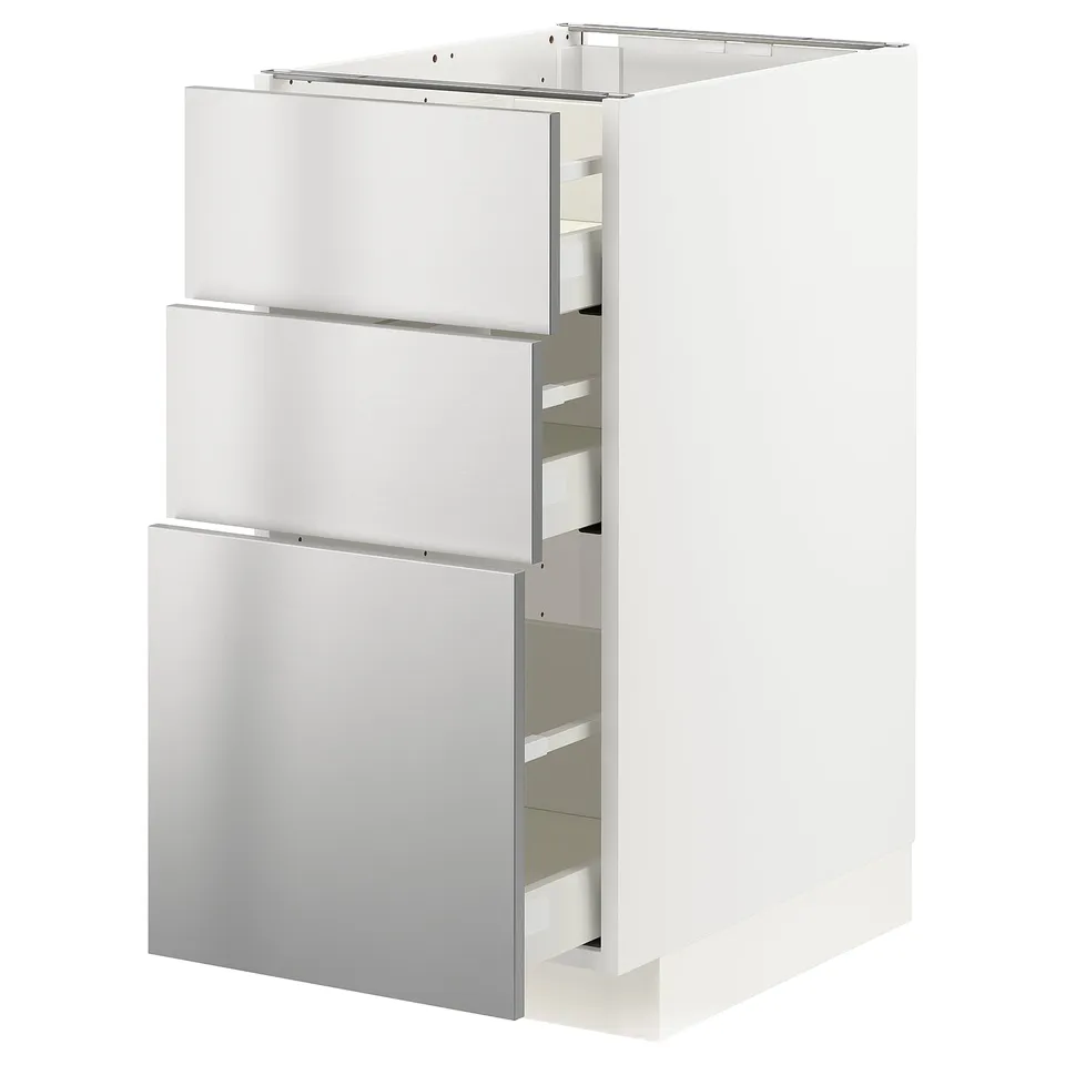A white METOD kitchen cabinet with three stainless steel drawers.