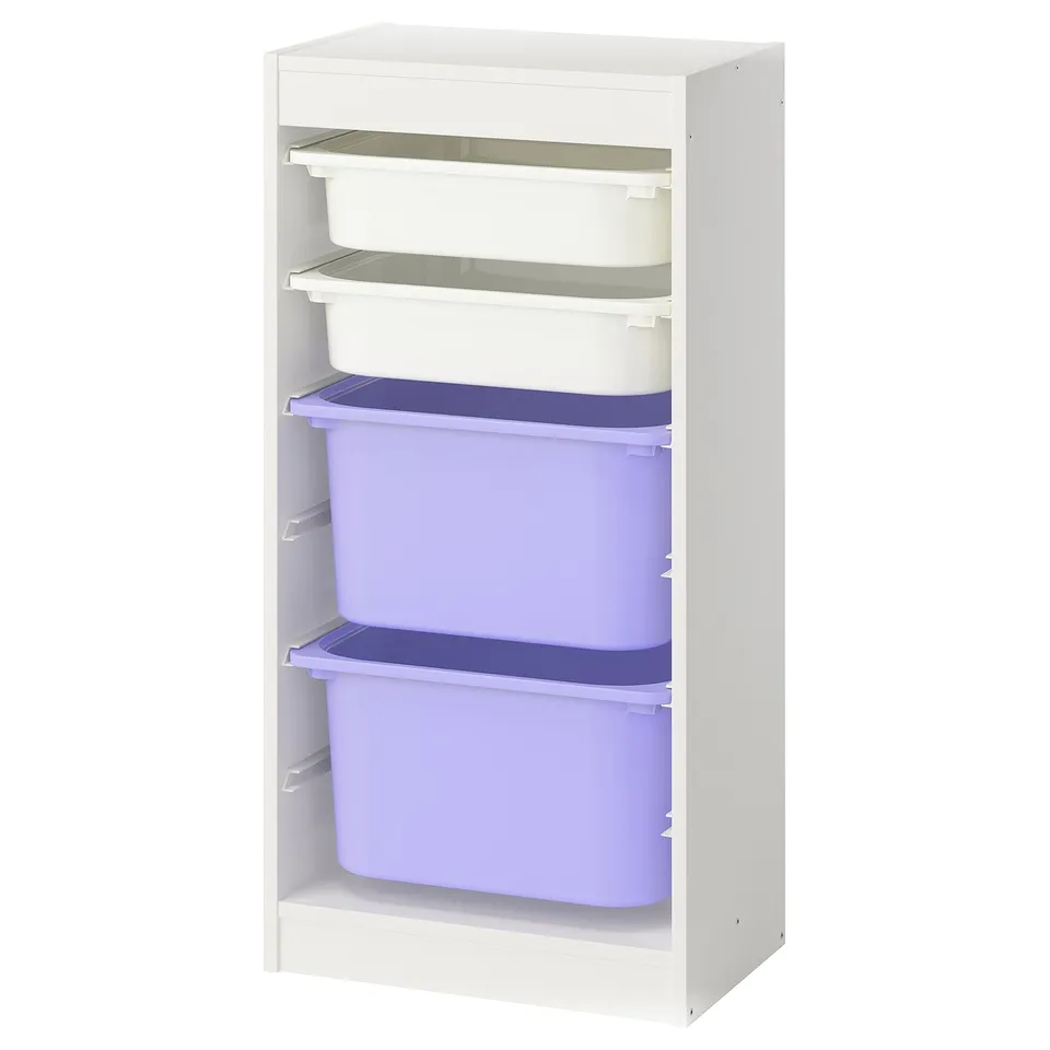 A white TROFAST storage unit with purple and clear plastic bins. Its designed for kids, allowing easy access and organisation.