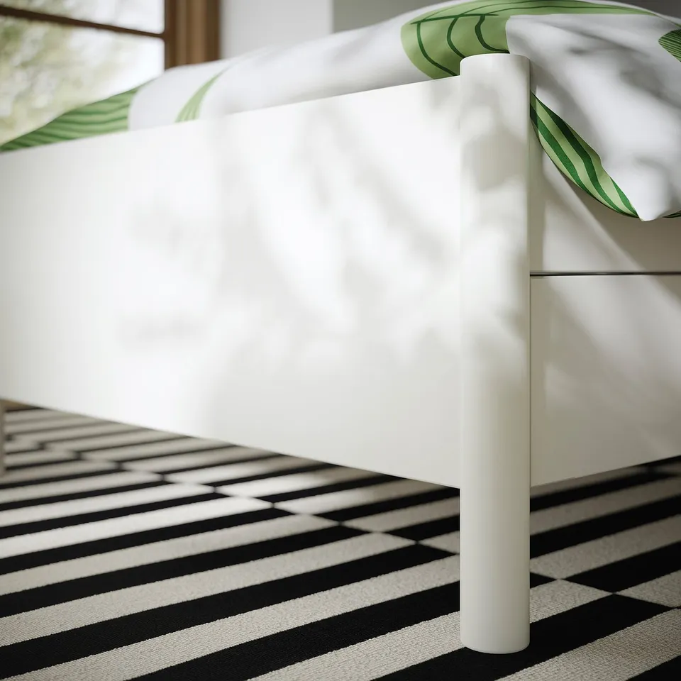 Off-white bed frame with drawers, sturdy build, smooth drawers, fresh mattress base.