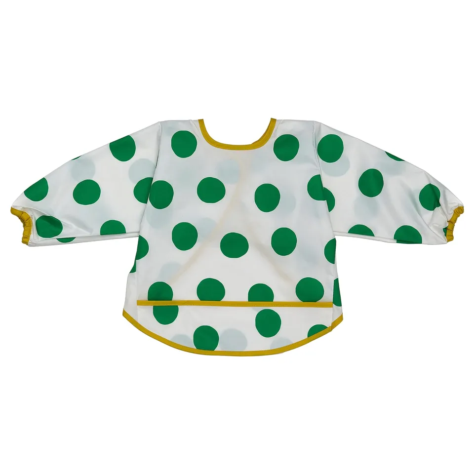 Polka-dot bib in white and green, full sleeve, yellow accents, soft polyester.