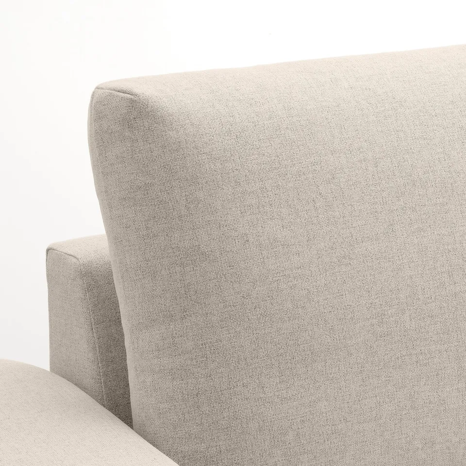 Grey fabric sofa close-up showing smooth, durable texture and clean stitching, highlighting comfort and quality.