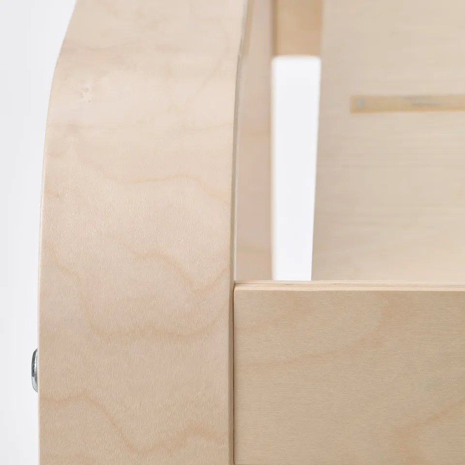 Light wood furniture detail; smooth finish, clean edges.
