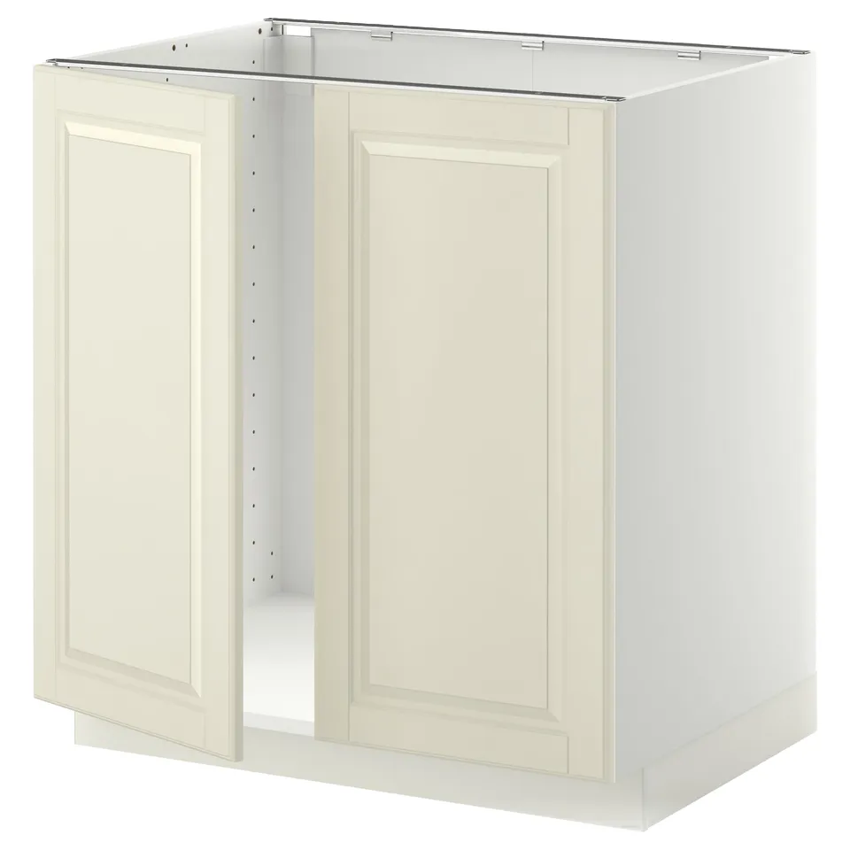 A white METOD kitchen cabinet with two off-white bevelled doors. It has a sturdy frame and snap-on hinges.