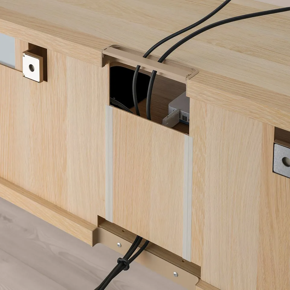 Wooden tv bench with cable management, showcasing cable outlets and adjustable shelves.