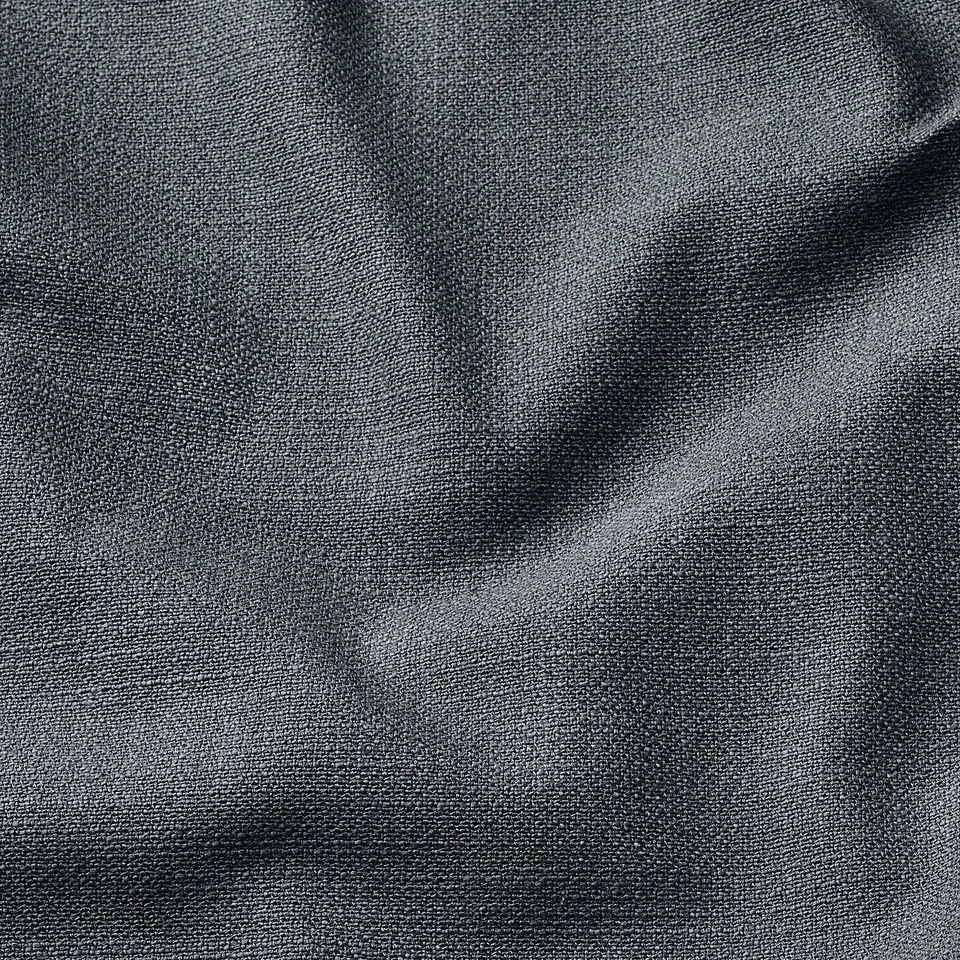 Close-up of textured fabric, slightly lustrous, appearing soft and high-quality, likely sofa cover material.