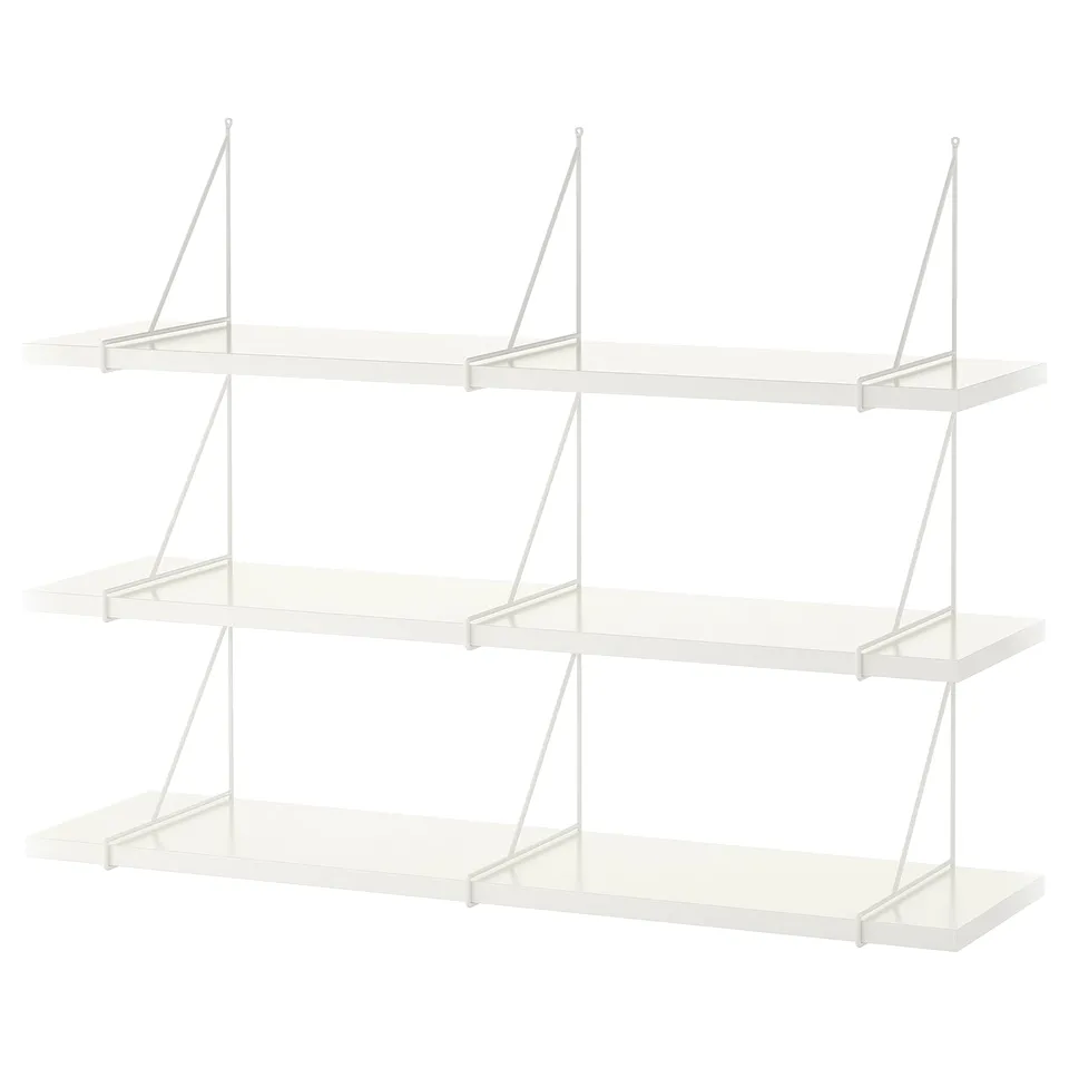 A white, modern, three-shelf wall unit. Each shelf has a bevelled and smooth edge. The shelves are held by metal brackets.