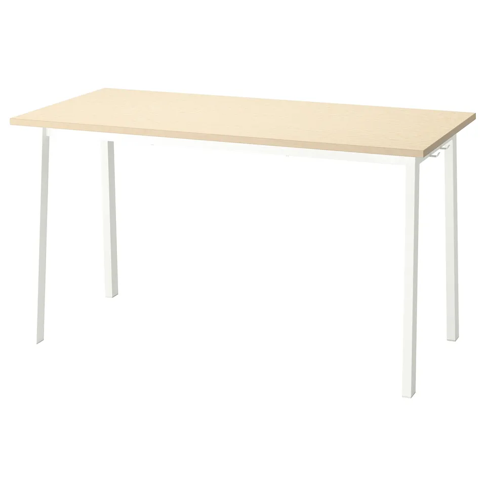 A MITTZON conference table. Its light brown with white legs, rectangular in shape, and has a simple design.