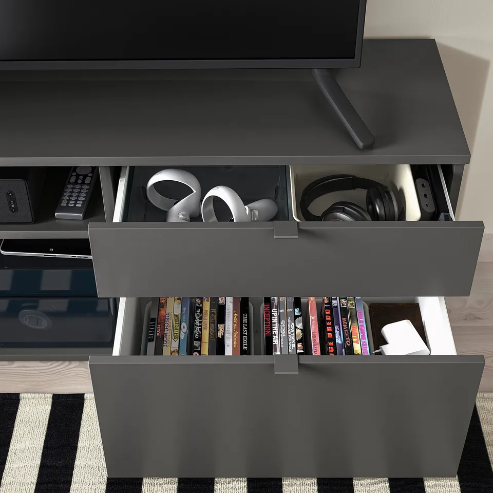 Black tv stand with open and closed storage; holds electronics, dvds, and books. Drawers hide clutter; top for tv.