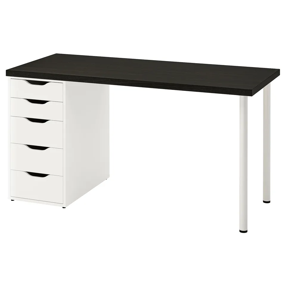 The LAGKAPTEN desk a black top and white drawer unit with four drawers. It has a modern, minimalist design with cut-out handles.