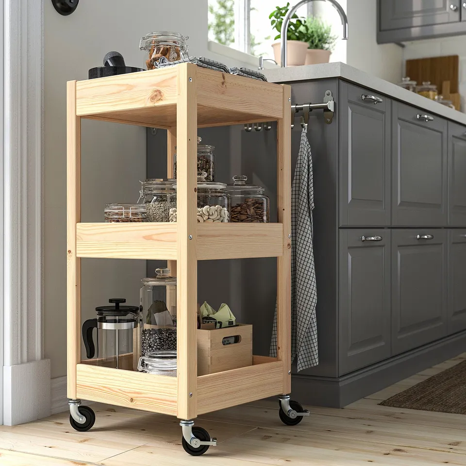 Wooden LOSHULT kitchen trolley, 3-tier, natural. Mobile with locks, corner-fit, warm glow.
