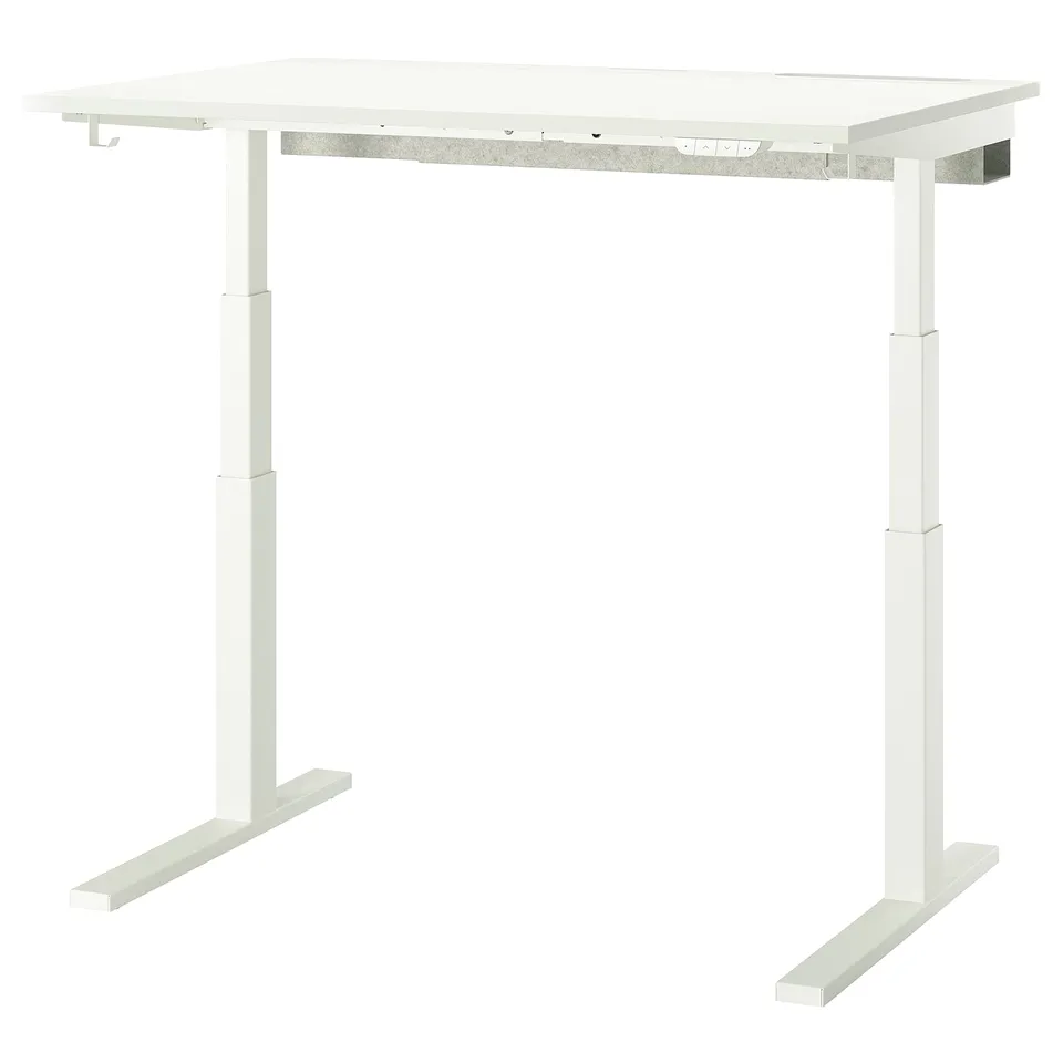 A white MITTZON sit/stand desk with a rectangular shape and metal legs. It includes cable management and a control panel for height adjustment.