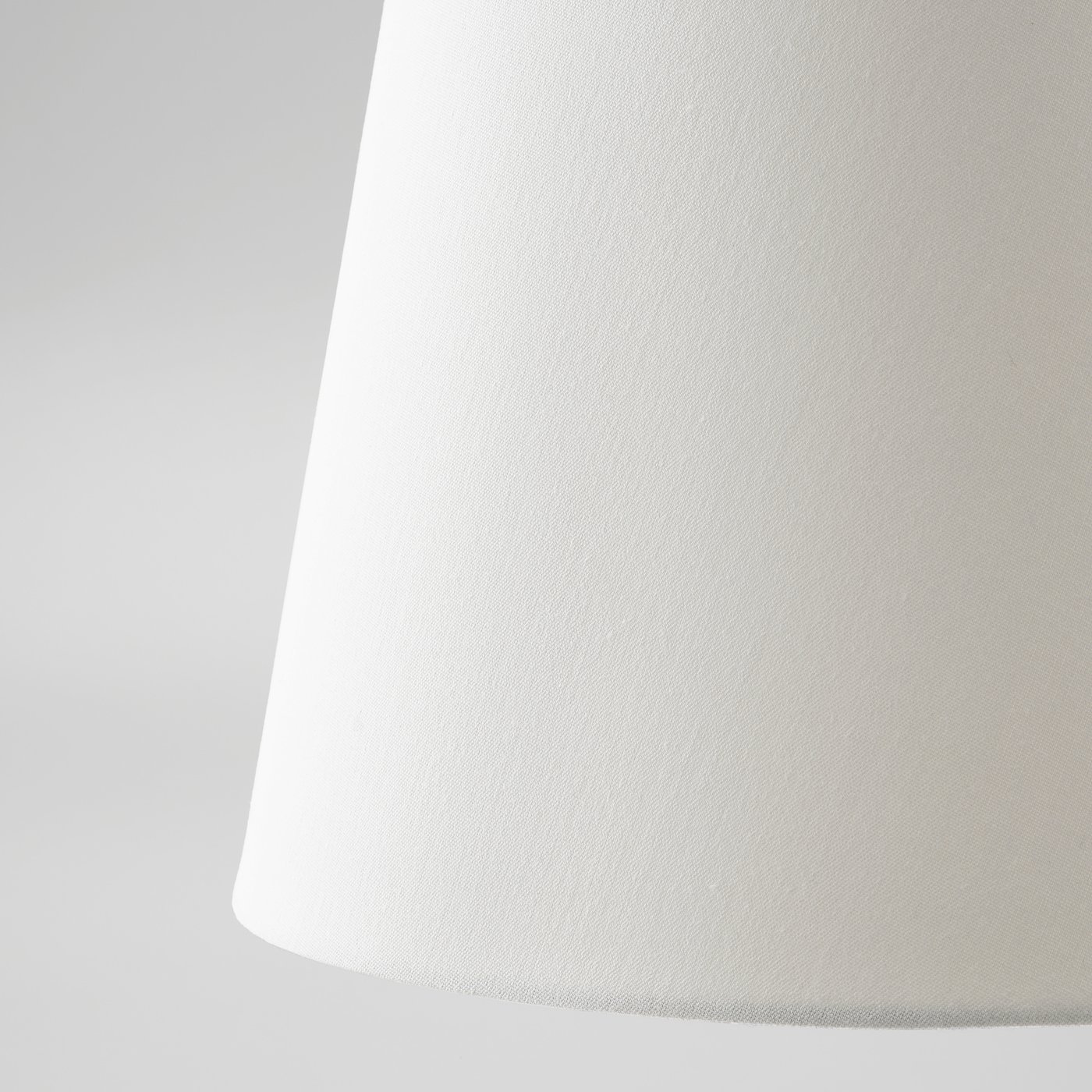 Close-up of white SKOTTORP lampshade showcasing quality, smooth texture, and sturdy design.