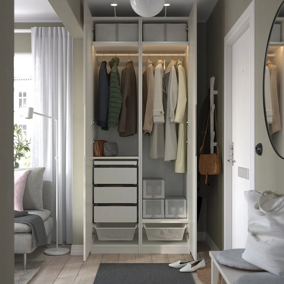 Wardrobe with drawers, baskets, and hanging space for clothes and bags.