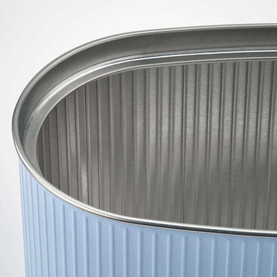 Close-up of a stylish, corrugated tin container. Textured metal surface, durable material, showcasing quality craftsmanship.