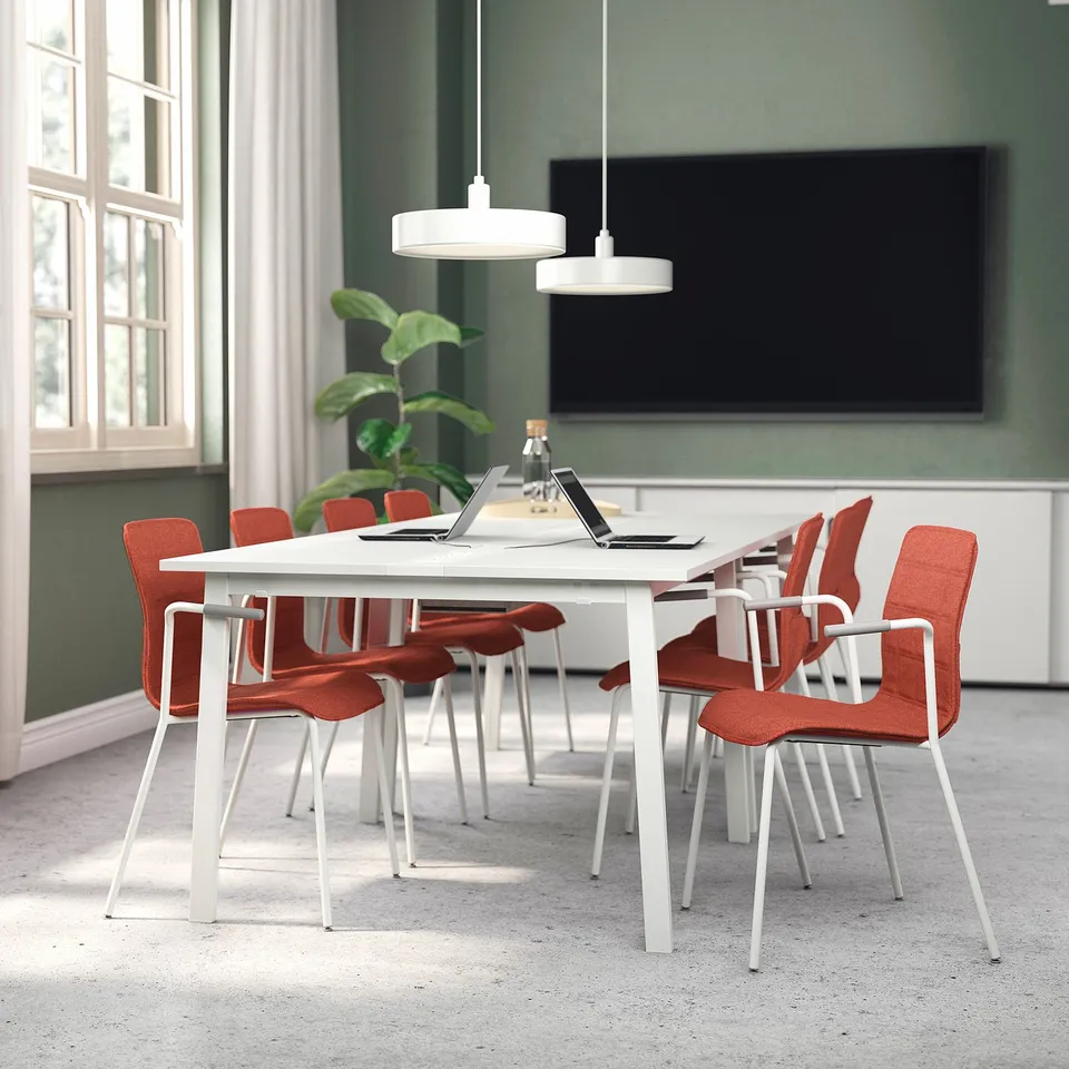 Mitzon conference table with red chairs in modern office.