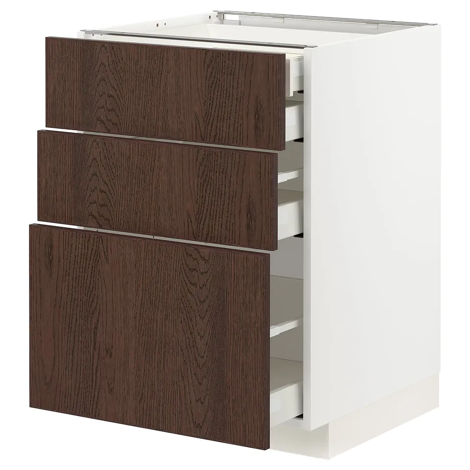 A white METOD kitchen cabinet with three dark brown sinarp drawers featuring oak veneer and solid wood edging.