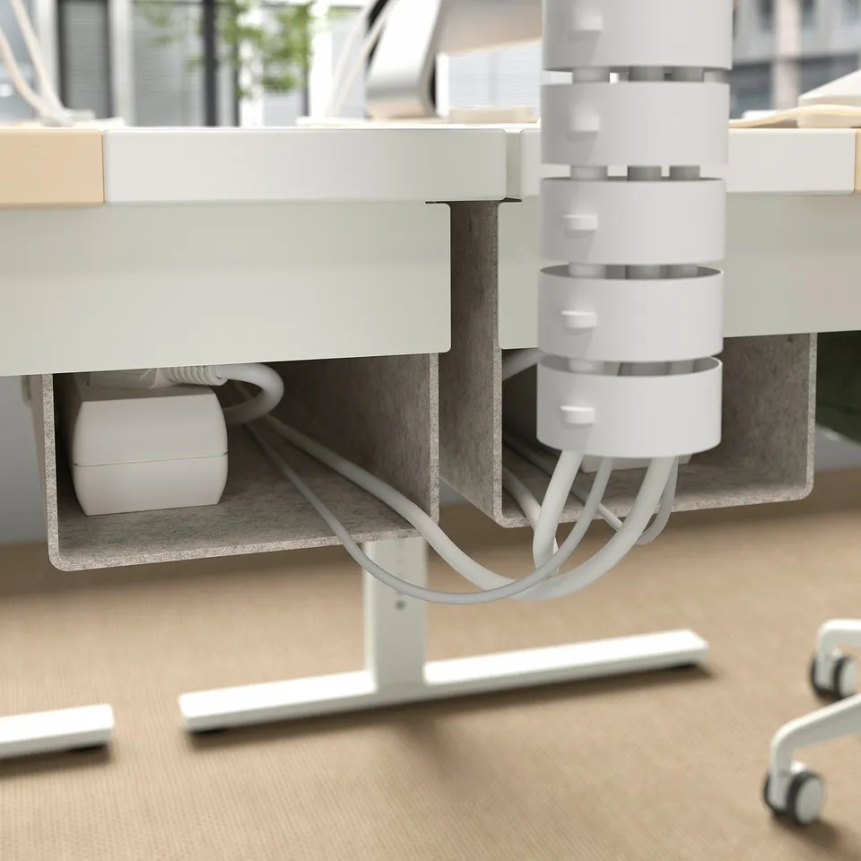 Under-desk cable management tray with adjustable legs.