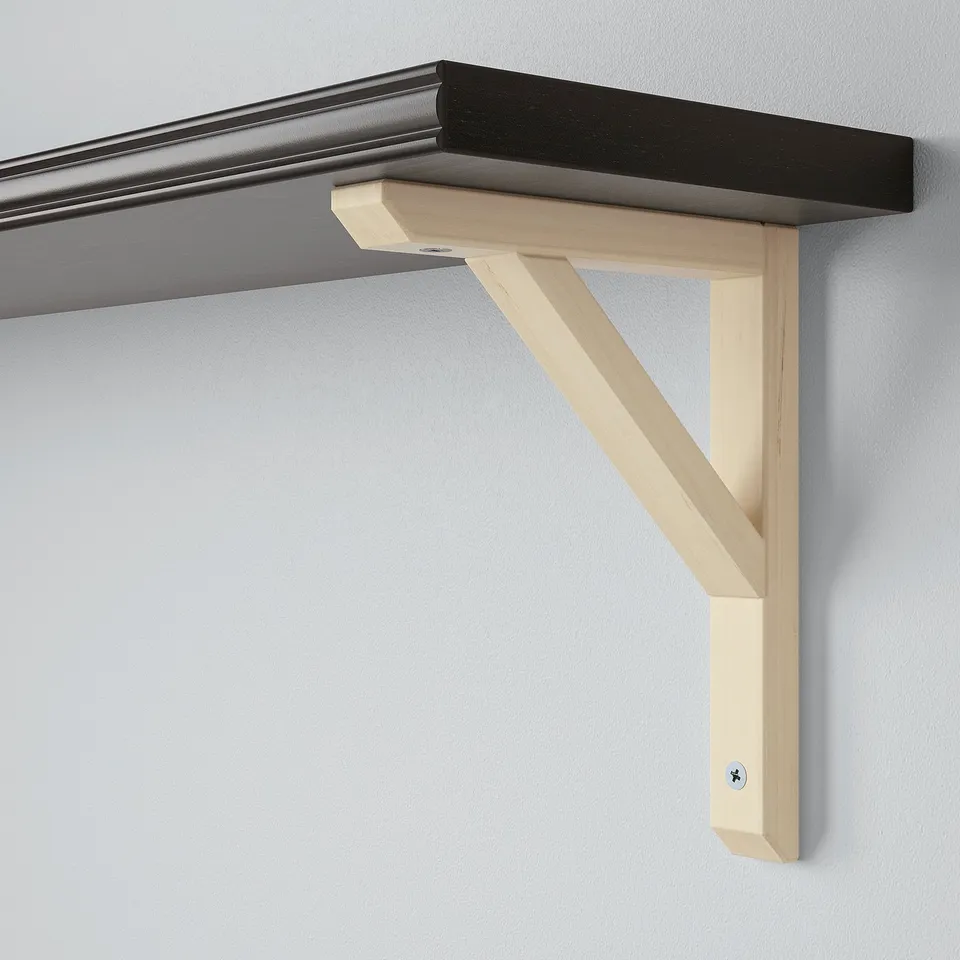 Light wooden wall shelf with minimalist bracket, mounted on grey wall. Simple, sturdy design for versatile use.