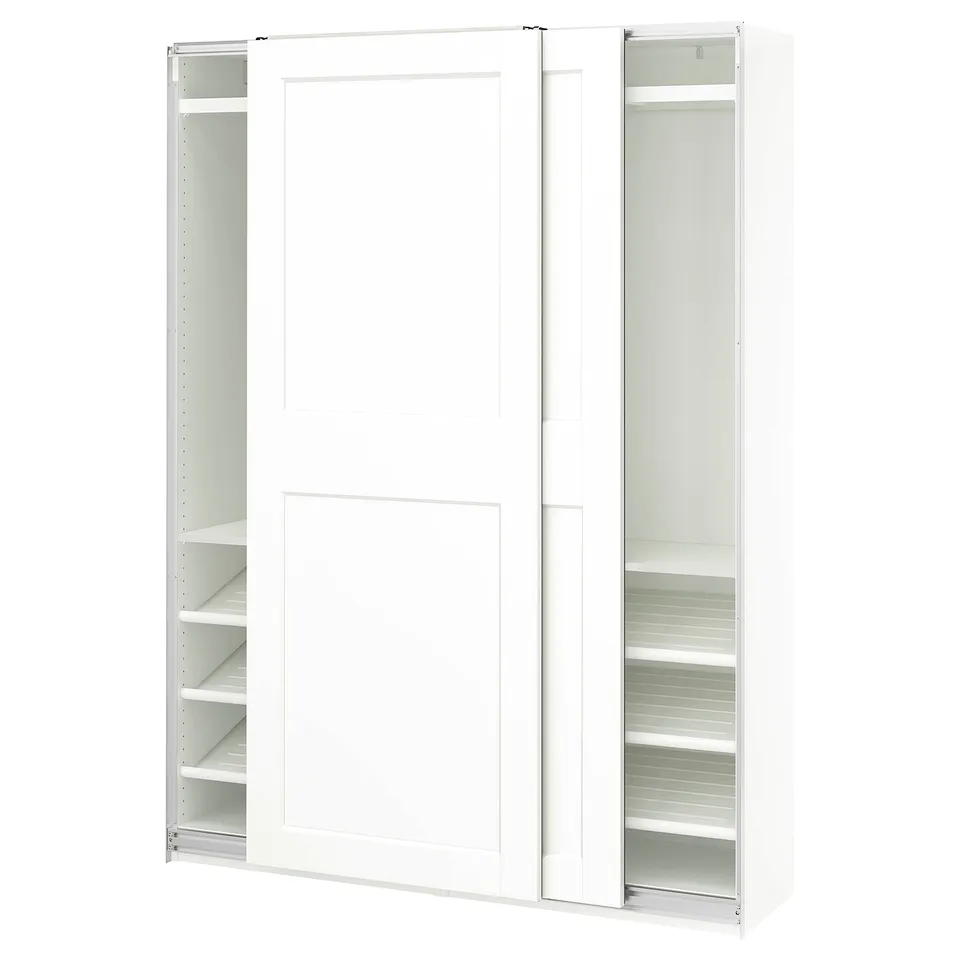 A white PAX wardrobe with sliding doors and internal shelves.