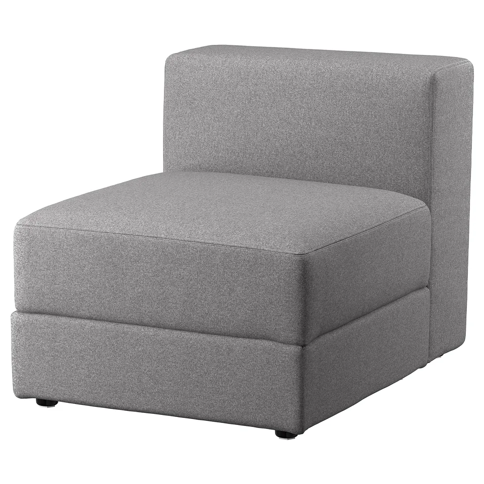 A grey, upholstered JÄTTEBO sofa module in a modern design. It a square shape with clean lines and includes built-in storage.