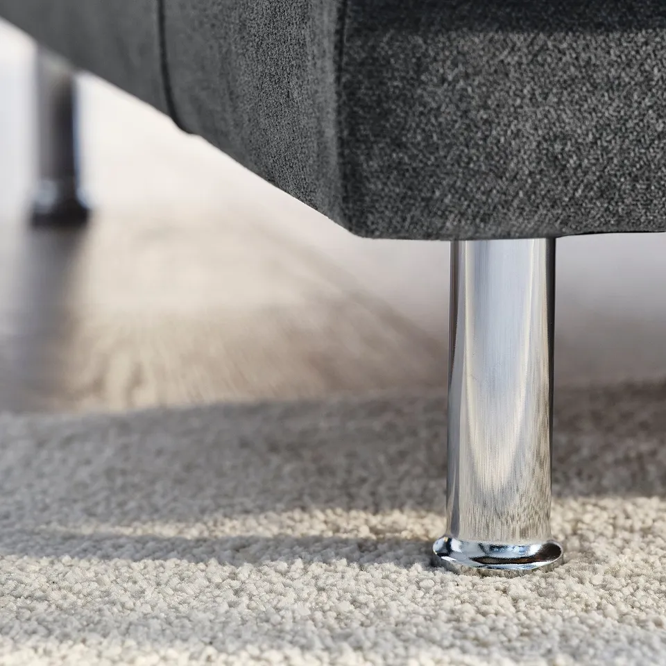 Modern sofa with chrome legs and textured fabric, showcasing high-quality design and comfort.