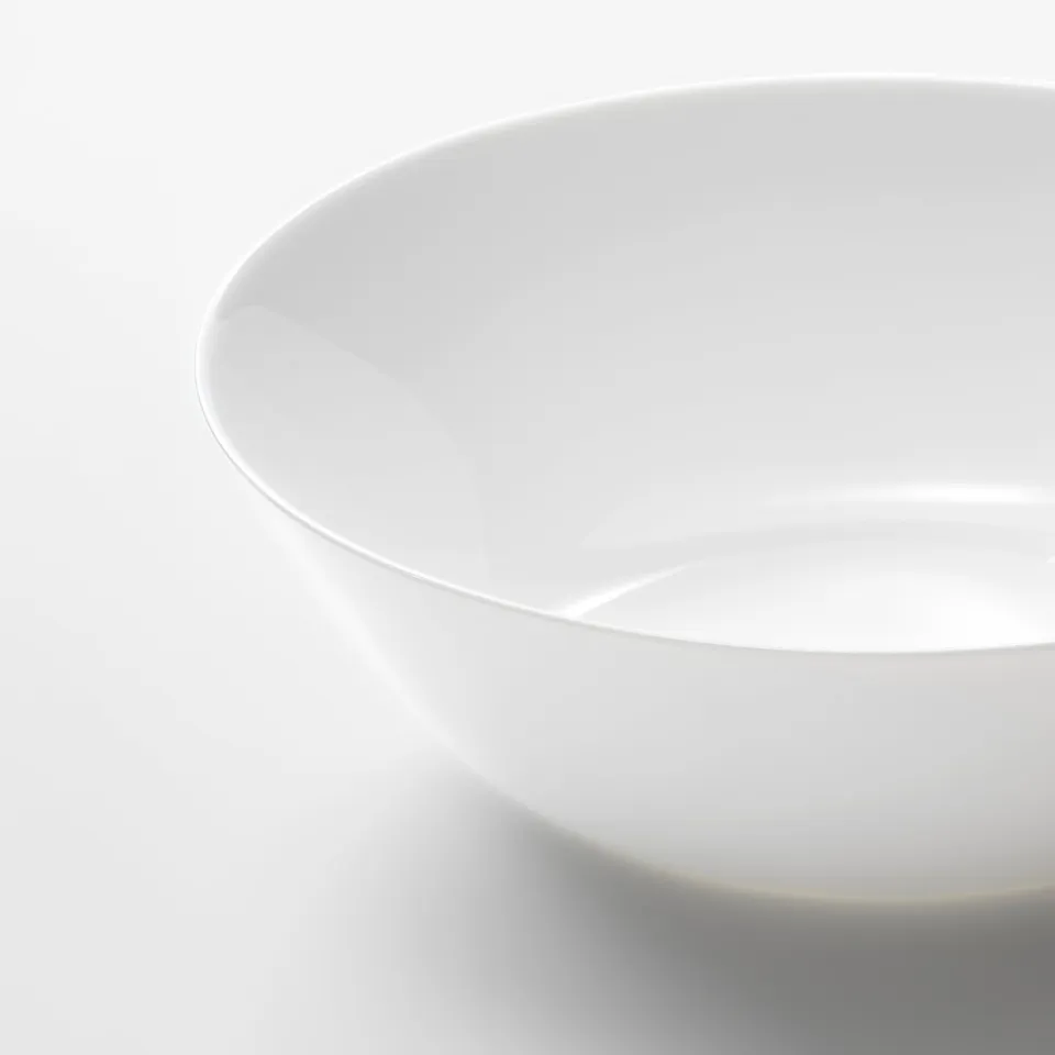 Smooth, pristine white bowl; gleaming, durable glass.