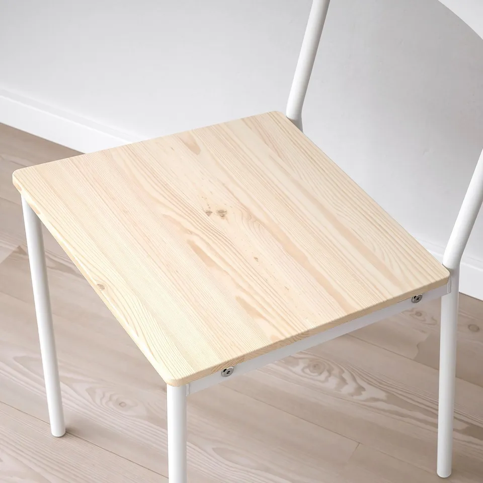 Small wooden table with white metal legs, clean and modern design.