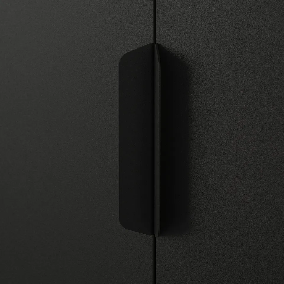 Close-up of a sleek, modern black metal drawer handle; minimalist, high-quality design.