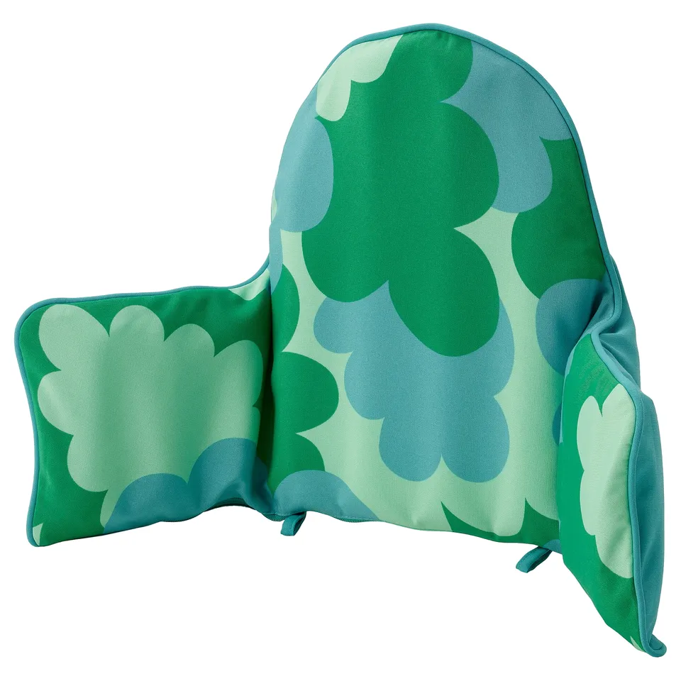 Green patterned baby highchair cushion, leaf design, inflatable, comfortable, attaches to table.
