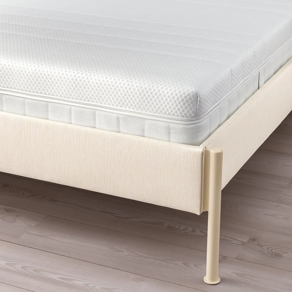 Bed frame with adjustable sides and padded headboard.