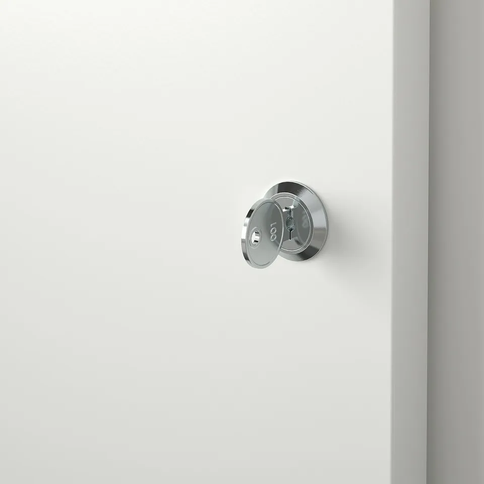 Chrome door lock on white cabinet, securely fastened, designed for durability and modern aesthetics.