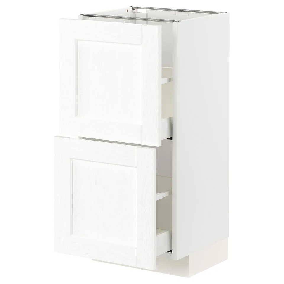 A white METOD kitchen cabinet with two doors and an open drawer, displaying modern design and storage.