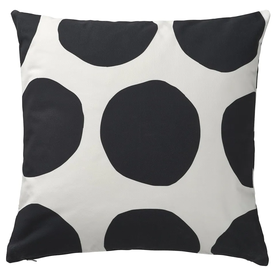 Black and white square cushion with large dots. Modern, minimalist decor. Hidden zip closure.