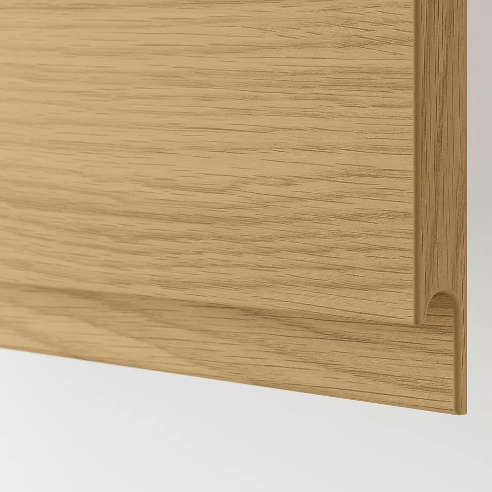 Close-up of modern wooden drawer with sleek design and golden handle.