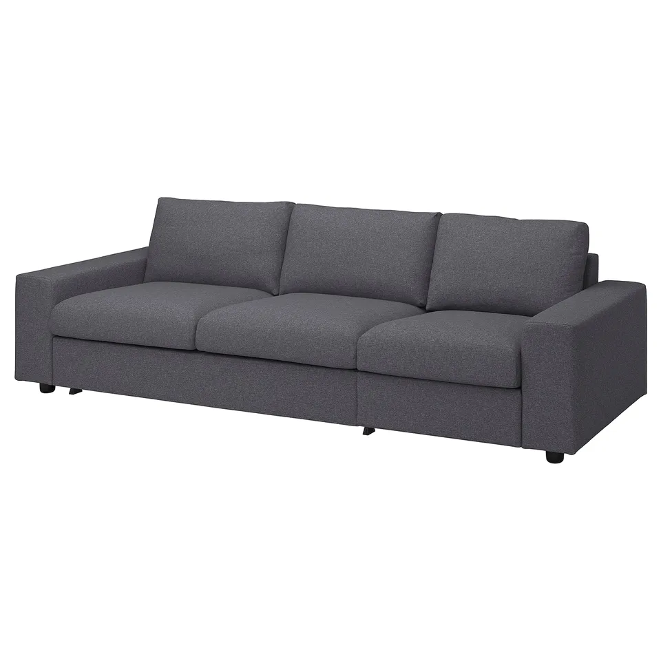 Modern dark grey fabric sofa with three back cushions and sleek, simple design.