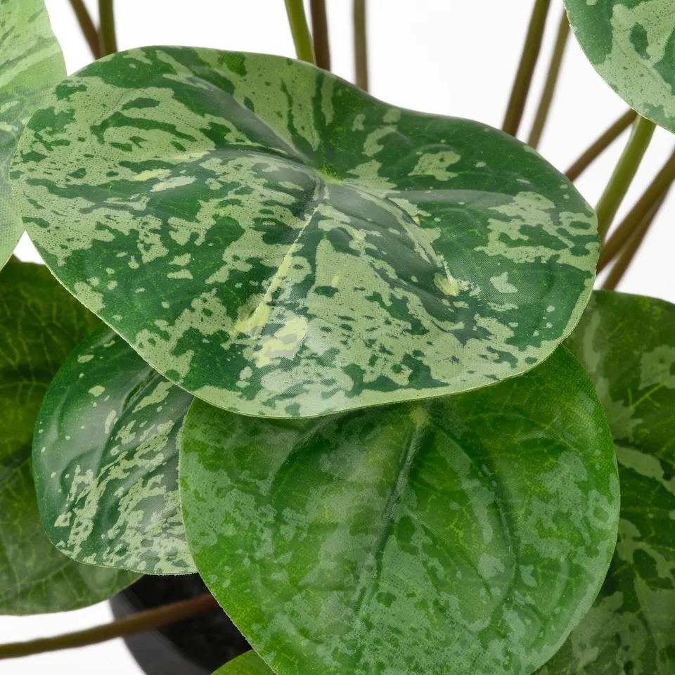 Lush artificial plant with lifelike, textured green leaves. Eco-friendly, recycled materials.