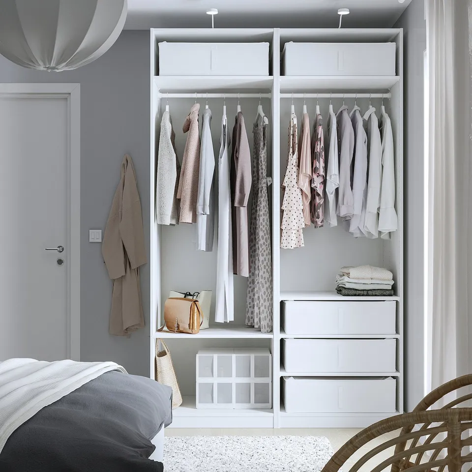 Modern grey bedroom with built-in wardrobe and SKUBB storage.