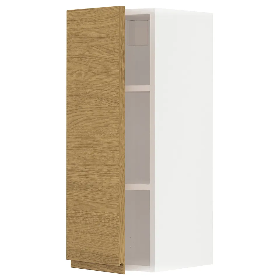 A white and light oak cabinet from the METOD kitchen system. It has a minimalist design with two shelves inside.