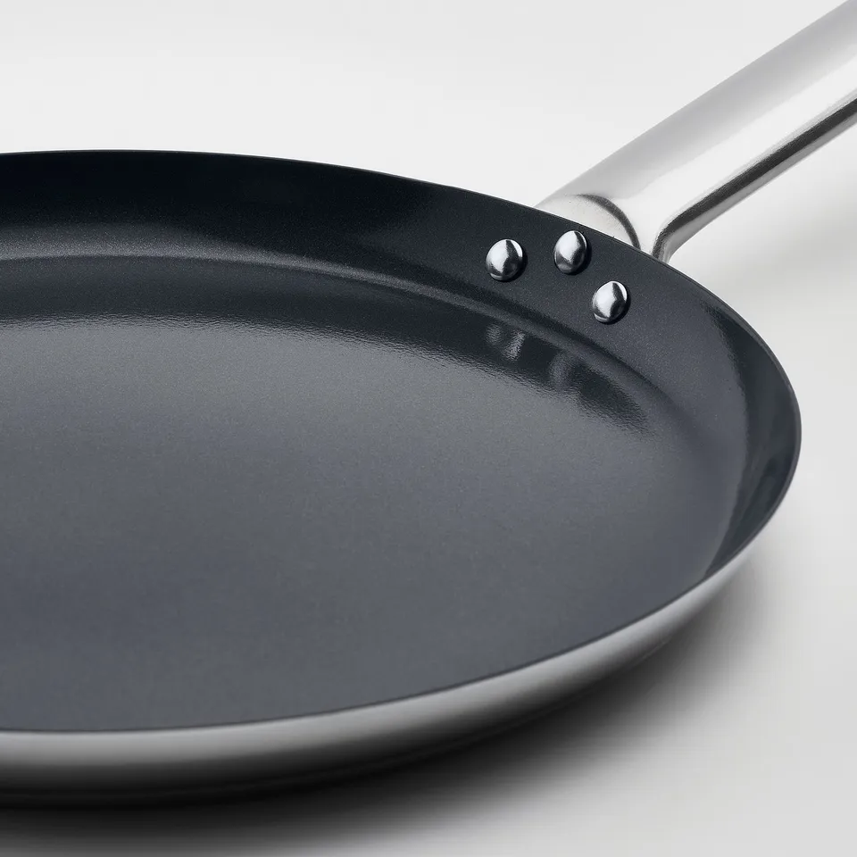 High-quality non-stick frying pan with a stainless steel handle, perfect for cooking various meals efficiently.