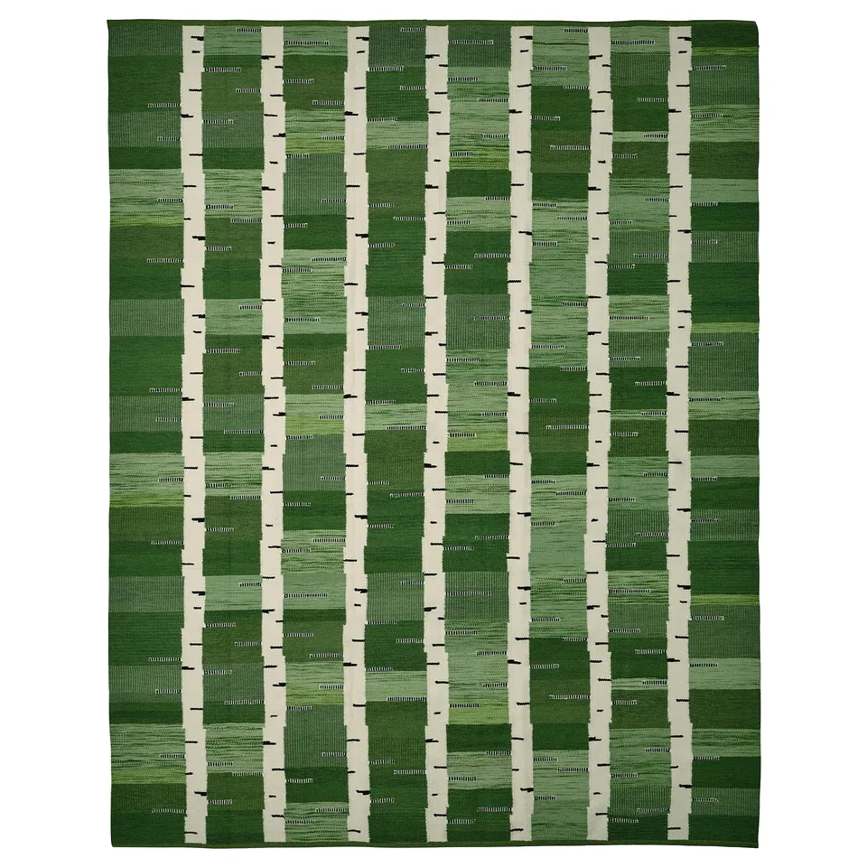 Handwoven green wool rug, birch tree design, rectangular shape, reversible.