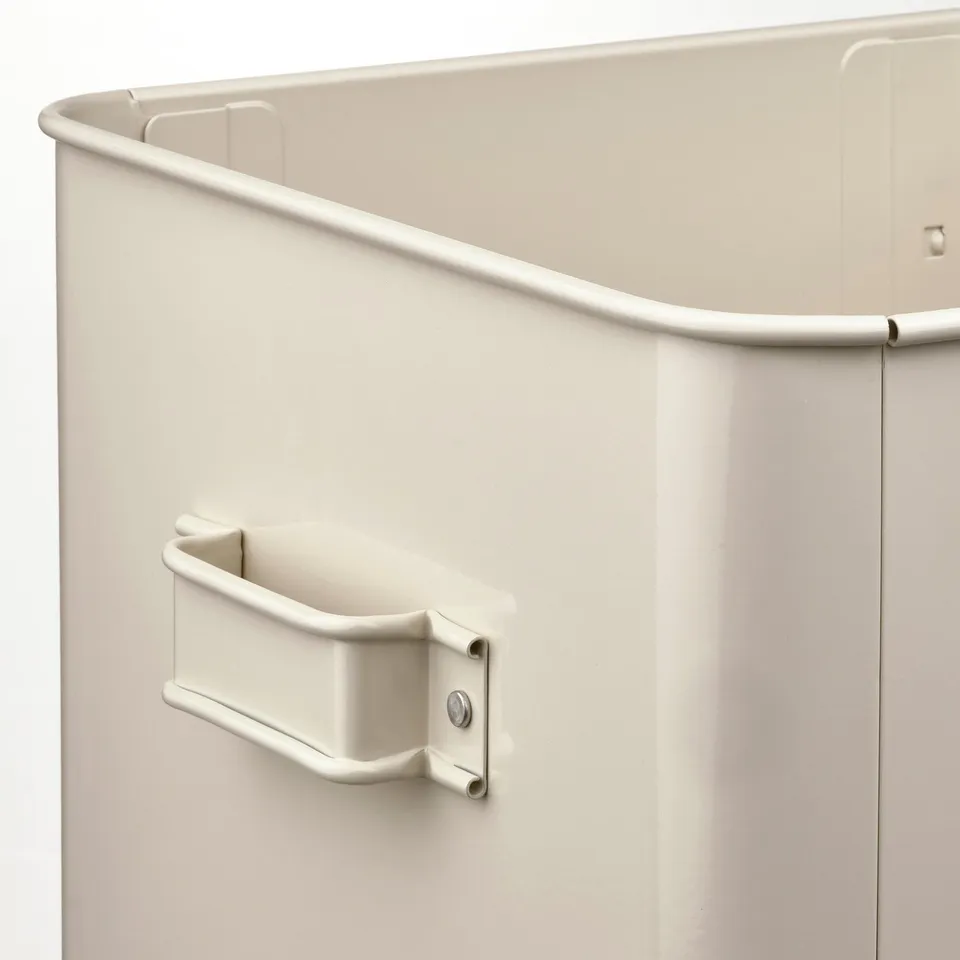 Beige metal storage box with curved top and handle, designed for various storage needs.