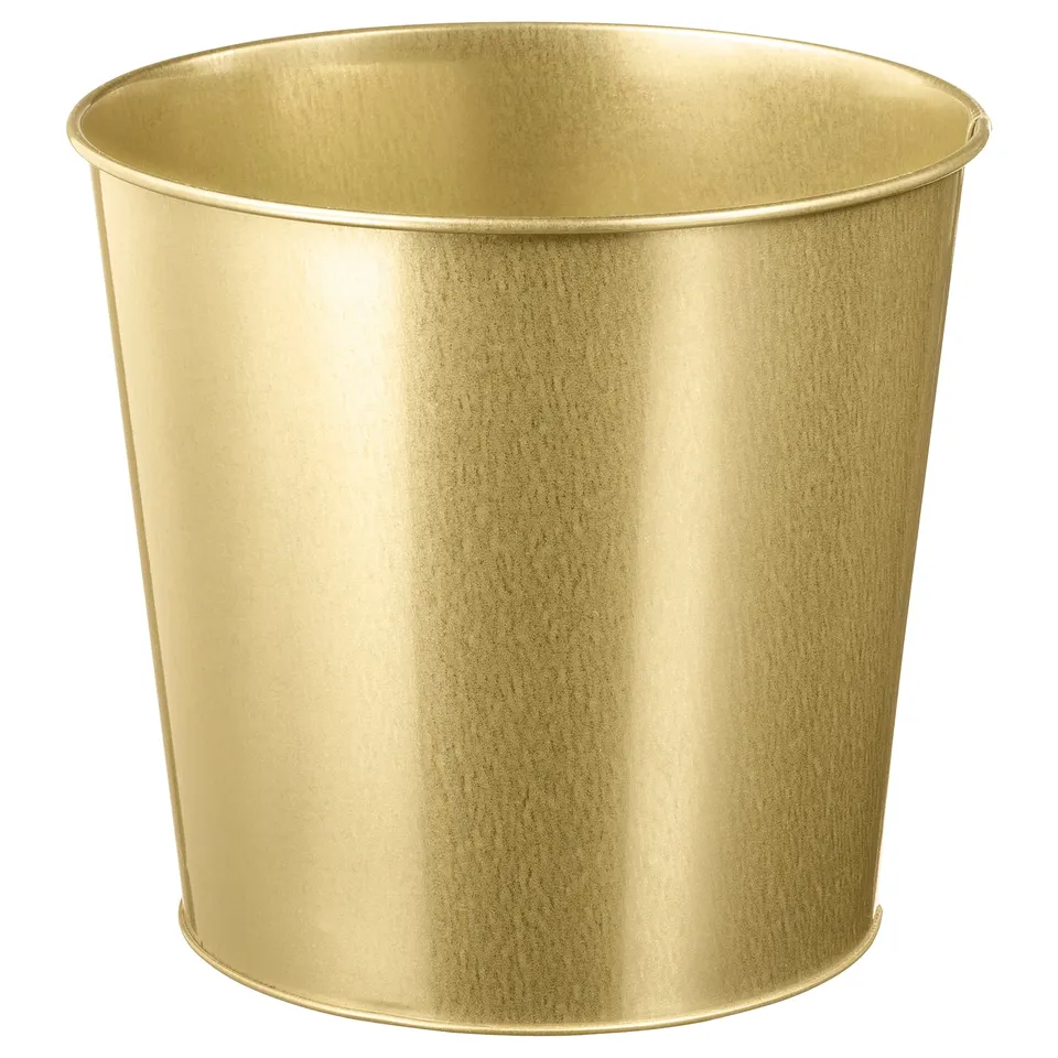 Gold-colored metal cylindrical vase on a white background. Sleek, modern design for indoor plants.